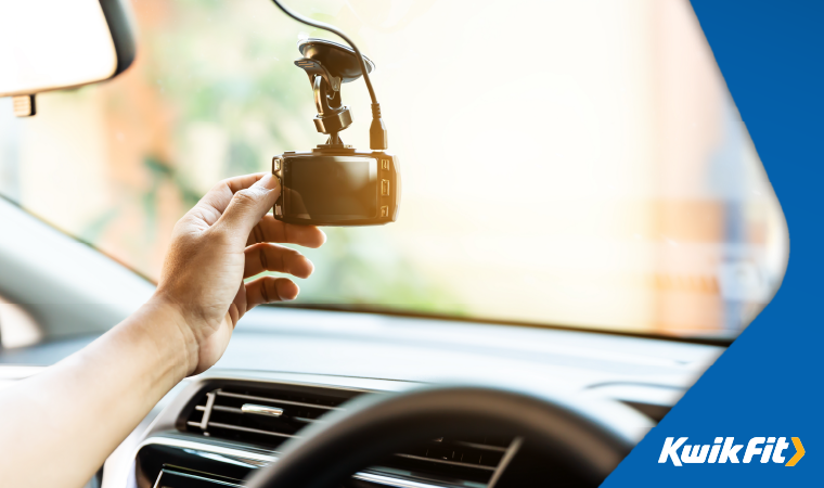 adjusting a front dash cam.