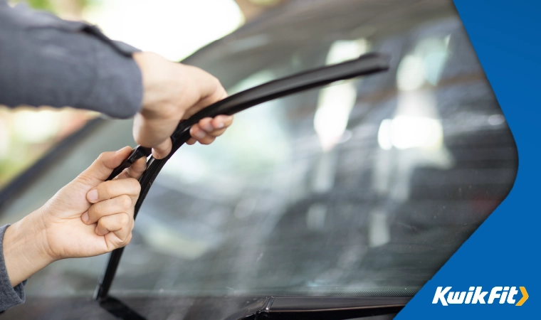 someone changing their front window wiper