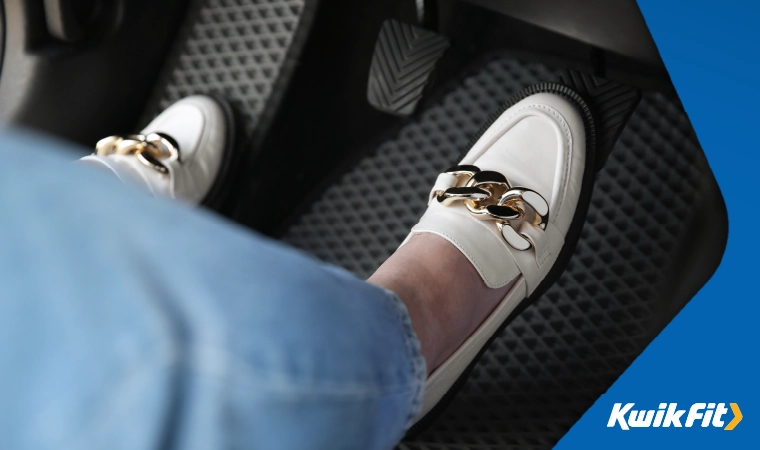 the driver pressing the pedals